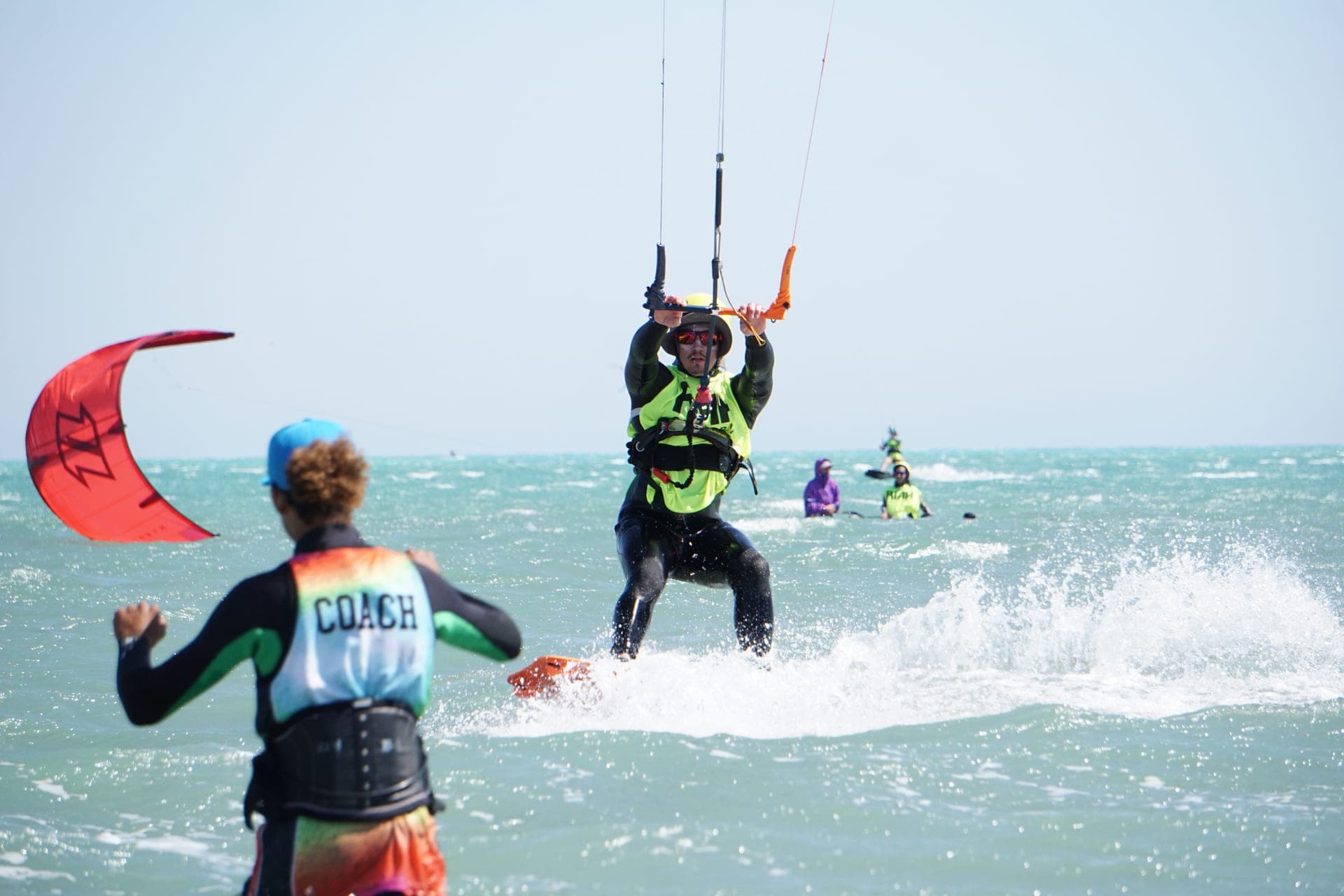 Anubis Kite coach watching a rider power up out of a water start