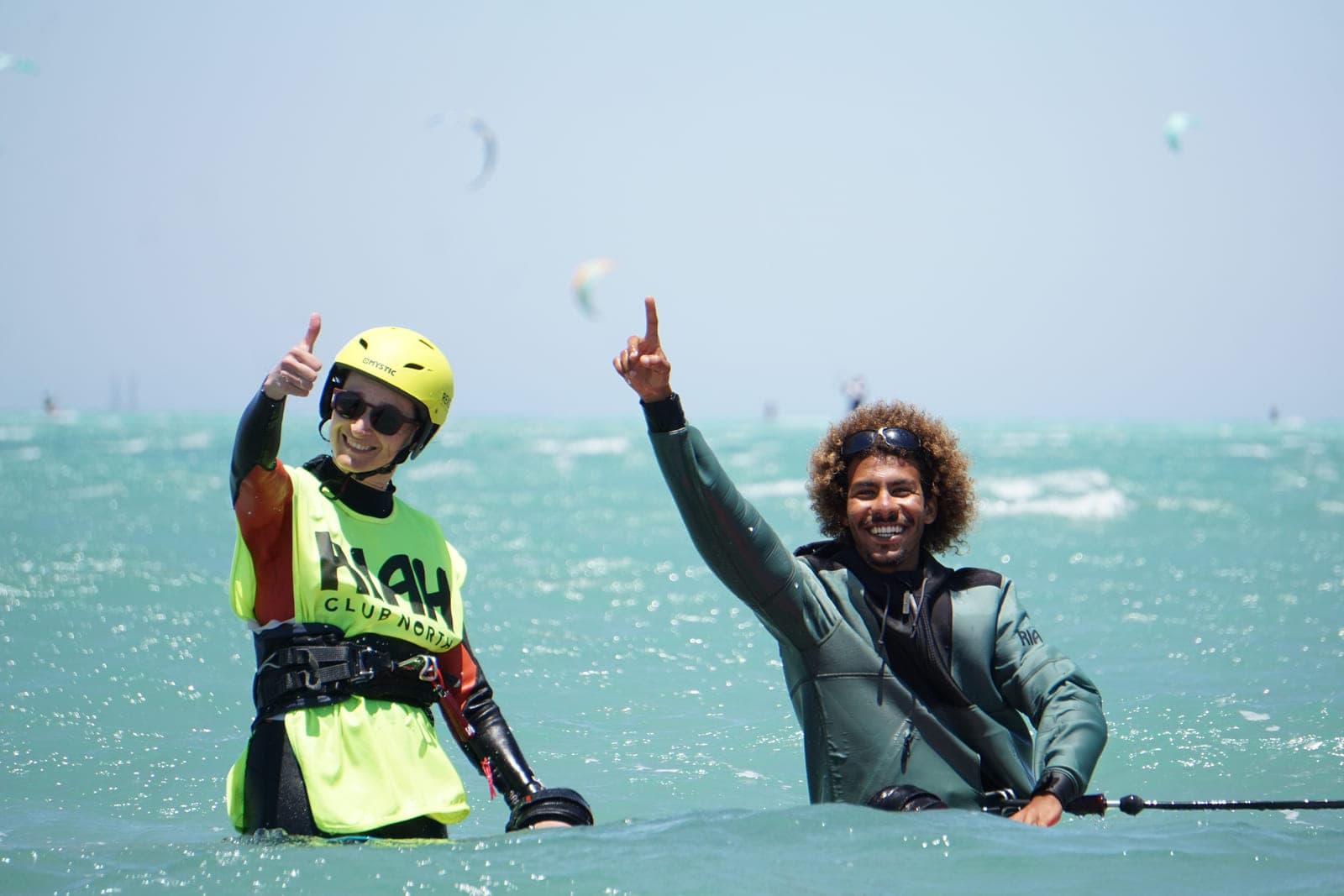 Student and instructor celebrating a first ride in the Red Sea
